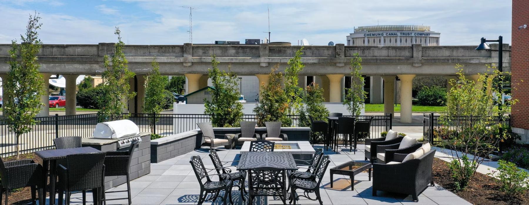 a patio with tables and chairs