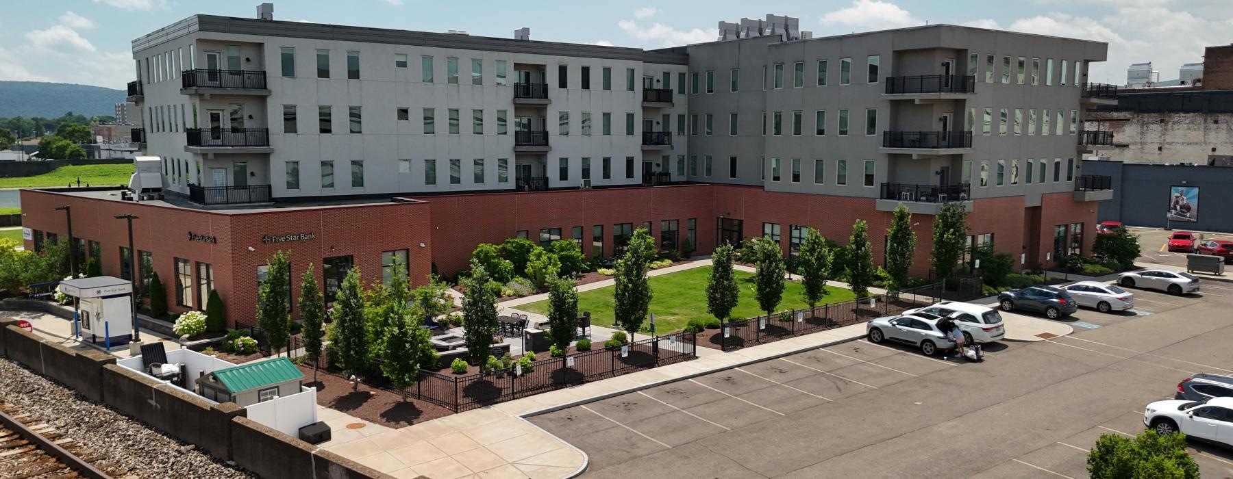 a large building with cars parked in front of it